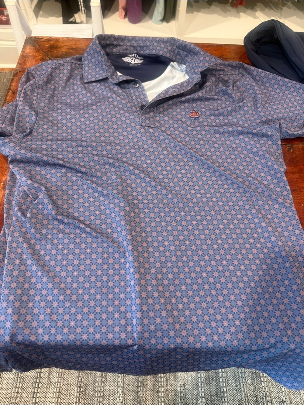 Men's Patterned Polo Shirt in Blue with Orange Motif